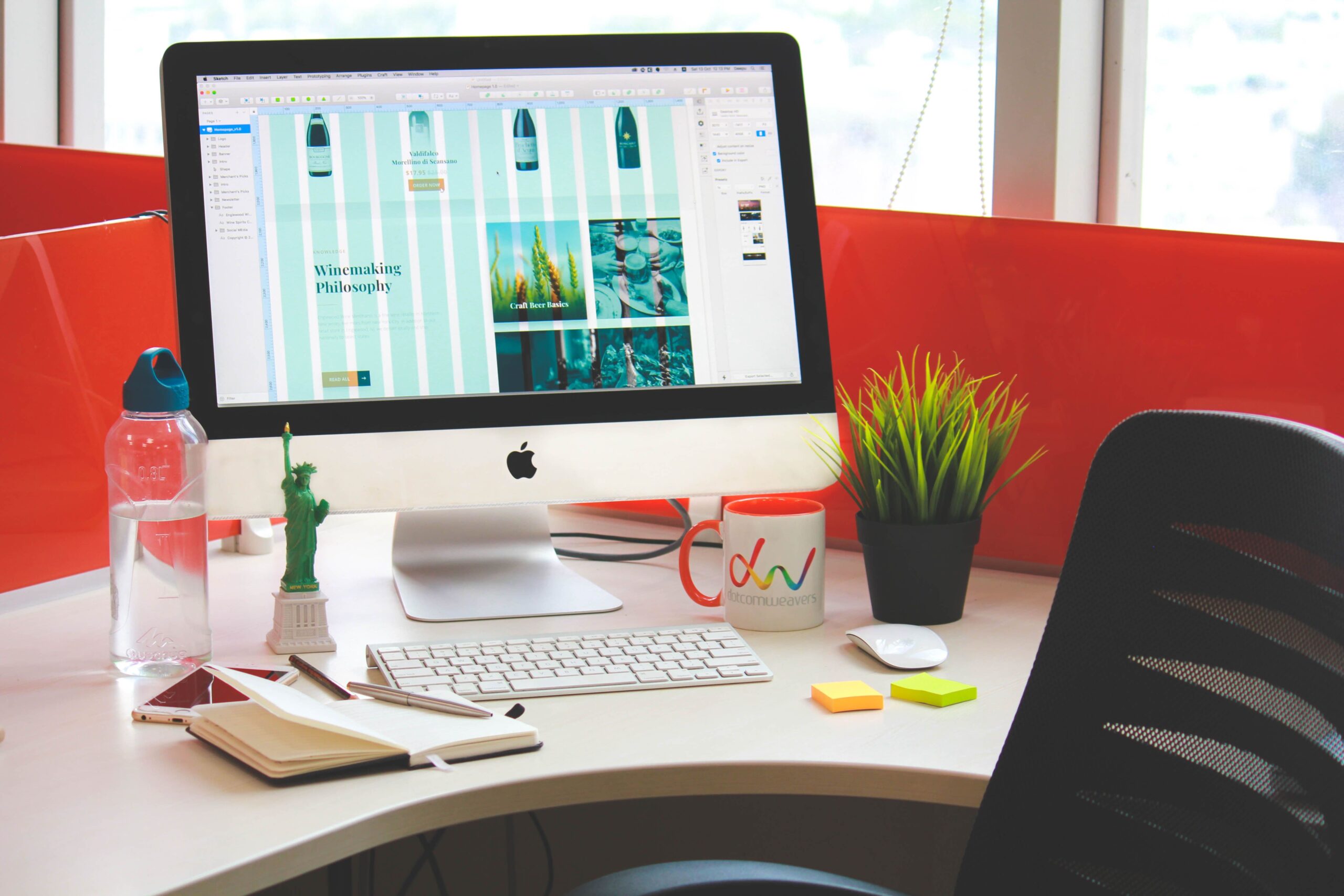 custom web design in progress on a desktop monitor in Figma.